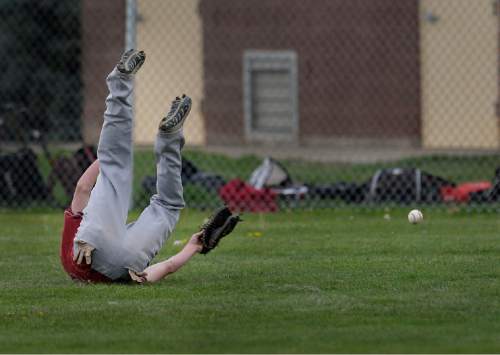 Scott Sommerdorf   |  The Salt Lake Tribune
Northridge right fielder Jake Porter misjudged this fly ball allowing Viewmont's Tyler Erickson to reach second base in the third inning. Viewmont defeated Northridge 3-1, Friday, April 24, 2015.