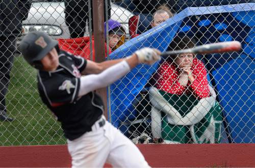 Scott Sommerdorf   |  The Salt Lake Tribune
Savvy fans took cover under umbrellas and tents as they watched Viewmont and Northridge battle under rain showers. Viewmont defeated Northridge 3-1, Friday, April 24, 2015.