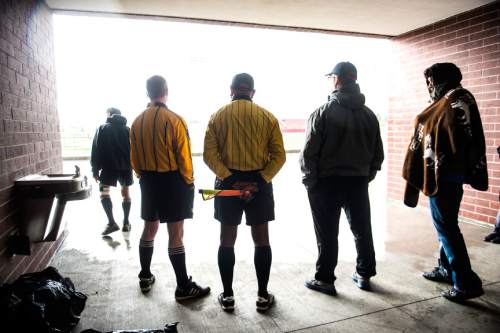 Chris Detrick  |  The Salt Lake Tribune
Soccer officials wait out a rain delay during the game at Granger High School Friday April 24, 2015.