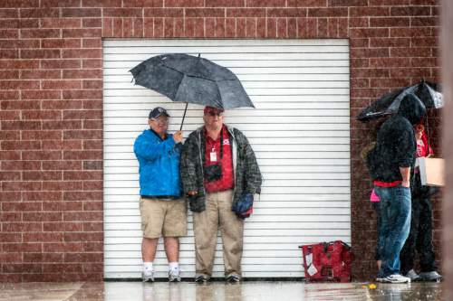 Chris Detrick  |  The Salt Lake Tribune
Fans wait out a rain delay during the game at Granger High School Friday April 24, 2015.