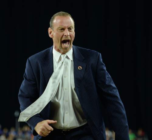 Steve Griffin  |  The Salt Lake Tribune

University of Utah head coach Larry Krystkowiak screams in disbelief after Utah Utes guard Delon Wright (55) picks up his second foul during first half action in the University of Utah versus Duke University Sweet 16 game in the 2015 NCAA Men's Basketball Championship Regional Semifinal game at NRG Stadium in Houston, Friday, March 27, 2015.