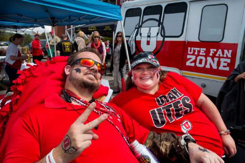 Trent Nelson  |  The Salt Lake Tribune
Iraq War veteran Nate Harris, with friend Heather Pulley, tailgating at the Utah Football Red & White game in Salt Lake City, Saturday April 25, 2015. His van, in the background, was decked out on Utah decor after a fundraiser on his behalf.