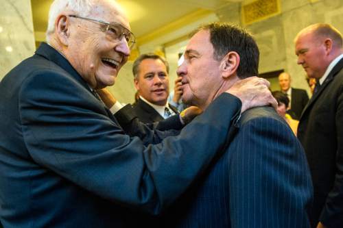 Chris Detrick  |  The Salt Lake Tribune
Gov. Gary Herbert gives L. Tom Perry of the Quorum of the Twelve Apostles his ceremonial pen used to sign SB296 at the Utah State Capitol Thursday March 12, 2015.