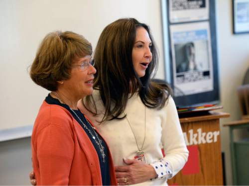 Al Hartmann  The Salt Lake Tribune
Leigh M. VandenAkker, a Techniques for Tough Times/social studies teacher at Salt Lake City's East High School, right, is surprised Monday April 27, 2015, by Karen Huntsman suddenly appearing in her classroom with a $10,000 gift. She is the first of 11 Huntsman Education Award winners for 2015.