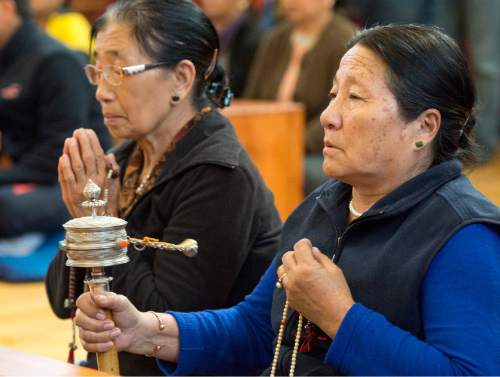 Rick Egan  |  The Salt Lake Tribune

Pema Choedon (left) prays, as Sonam Palmo (right) spins a Mani Lakhor, as she prays for the victims of the earthquake in Nepal with the Utah Tibet Society at the Urgyen Samten Ling Gonpa Tibetan Buddhist Temple,Sunday, April 26, 2015.