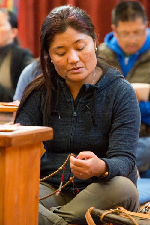Rick Egan  |  The Salt Lake Tribune

Tashi You Don prays for the victims of the earthquake in Nepal with the Utah Tibet Society at the Urgyen Samten Ling Gonpa Tibetan Buddhist Temple,Sunday, April 26, 2015.