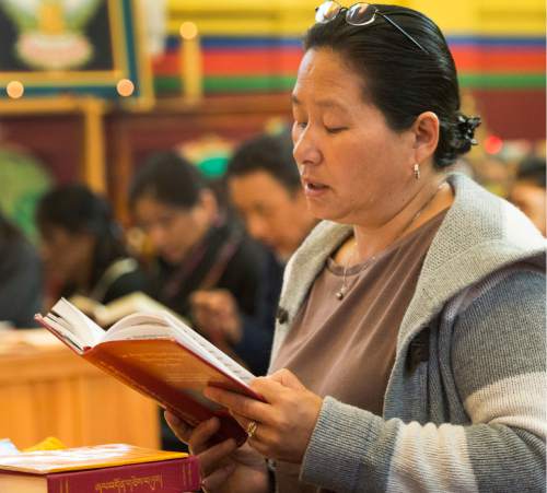 Rick Egan  |  The Salt Lake Tribune

Tsering Telishar prays for the victims of the earthquake in Nepal with the Utah Tibet Society at the Urgyen Samten Ling Gonpa Tibetan Buddhist Temple,Sunday, April 26, 2015.