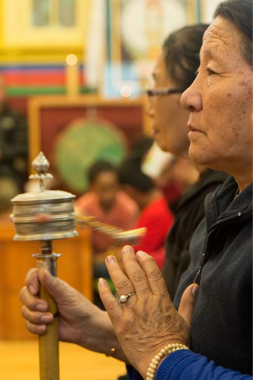 Rick Egan  |  The Salt Lake Tribune

Sonam Palmo spins a Mani Lakhor, as she prays for the victims of the earthquake in Nepal with the Utah Tibet Society at the Urgyen Samten Ling Gonpa Tibetan Buddhist Temple,Sunday, April 26, 2015.