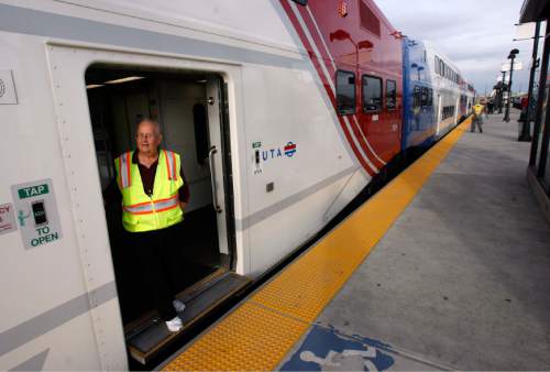 Francisco Kjolseth  |  The Salt Lake Tribune
Host Dick Lorange greets the media as they are invited to ride the new FrontRunner line from Salt Lake City to Provo on Friday, November 30, 2012, as UTA gets ready to open for regular service on Monday, December 10, 2012. The public is also welcome to try out the line as part of their "Food for your fare" on Saturday, December 8, 2012, from 10 a.m to 10 p.m by providing a non-perishable food item to be donated as "fare" to benefit the Utah Food Bank and the Community Action Services.
