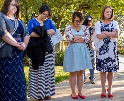 Trent Nelson  |  The Salt Lake Tribune
Ellen Koester, Analisa Estrada, Cheryl Holdaway, and Abby Hansen pray before entering a broadcast of the LDS General Priesthood Session at BYU's Marriott Center in Provo Saturday October 4, 2014. The event was one of several planned by Ordain Women.