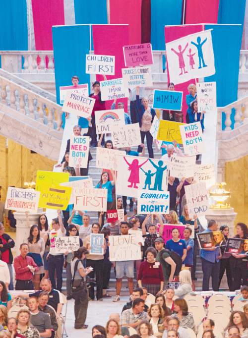 Steve Griffin  |  The Salt Lake Tribune

People hold signs as they listen to speakers during the Stand for Marriage Rally sponsored by Celebration of Marriage, Standard of Liberty, Utah Eagle Forum, United Women's Forum and Family Watch International at the Capitol in Salt Lake City, Tuesday, April 28, 2015.
