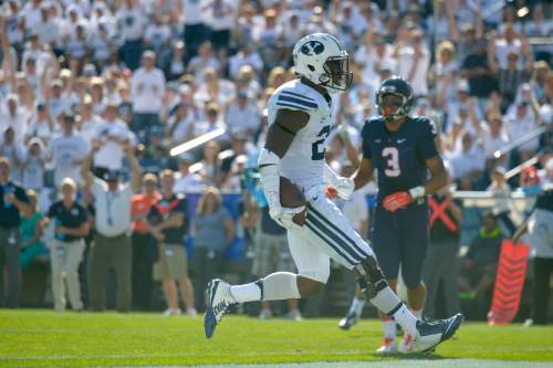 Chris Detrick  |  The Salt Lake Tribune
Brigham Young Cougars running back Jamaal Williams (21) celebrates his touchdown run during the second half of the game at LaVell Edwards Stadium Saturday September 20, 2014.  BYU won the game 41-33.