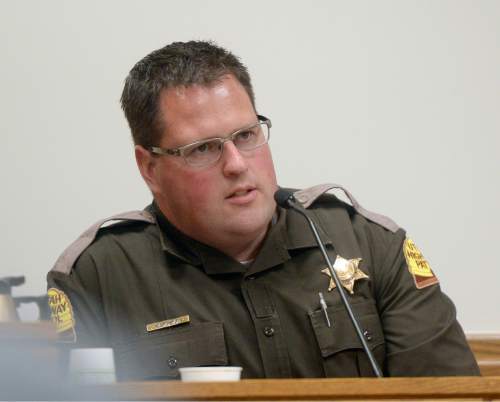 Al Hartmann  |  The Salt Lake Tribune

UHP patrolman Jeff Blankenagel testifies in the Meagan Grunwald trial in Provo, Utah, on Thursday, April 30, 2015.   She is charged as an accomplice in a shooting spree that killed one police officer and wounded another on January 30, 2014.  He gave chase in Juab County to the truck that Grunwald was riding in where speeds reached 110 miles-per-hour.  Blankenagel said that one or two shots were fired from the truck's back window while in pursuit.