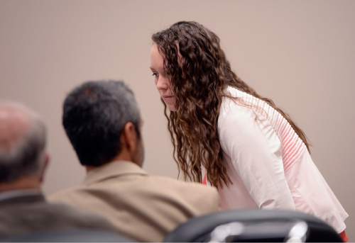 Al Hartmann  |  The Salt Lake Tribune

Meagan Grunwald who is charged as an accomplice in a shooting spree that killed one police officer and wounded another on January 30, 2014sits with her attorneys in Provo, Utah, on Thursday, April 30, 2015.