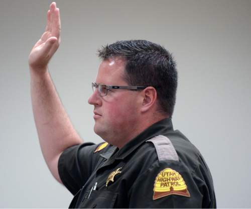 Al Hartmann  |  The Salt Lake Tribune

UHP patrolman Jeff Blankenagel is sworn in before testifying in the Meagan Grunwald trial in Provo, Utah, on Thursday, April 30, 2015.   She is charged as an accomplice in a shooting spree that killed one police officer and wounded another on January 30, 2014.  He gave chase in Juab County to the truck that Grunwald was riding in where speeds reached 110 miles-per-hour.  Blankenagel said that one or two shots were fired from the truck's back window while in pursuit.