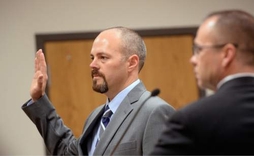 Al Hartmann  |  The Salt Lake Tribune
Utah County Sheriff Deputy Gregory Sherwood is sworn in to testify in the Meagan Grunwald trial in Provo, Utah, on Thursday, April 30, 2015.   She is charged as an accomplice in a shooting spree that killed one police officer and wounded Sherwood on January 30, 2014.  Sherwood was shot in the head and is unable to perform his regular duties as a deputy due to balance and communications problems. He is unable to drive a car  due to his disability from the shooting but still works in selected jobs with the department.