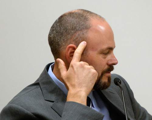 Al Hartmann  |  The Salt Lake Tribune
Utah County Sheriff Deputy Gregory Sherwood points to his head as he testifies in the Meagan Grunwald trial in Provo, Utah, on Thursday, April 30, 2015.   She is charged as an accomplice in a shooting spree that killed one police officer and wounded Sherwood on January 30, 2014.  Sherwood was shot in the head and is unable to perform his regular duties as a deputy due to balance and communications problems. He is unable to drive a car  due to his disability from the shooting but still works in selected jobs with the department.