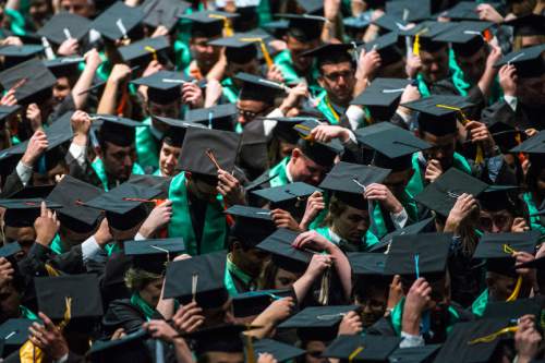 Chris Detrick  |  The Salt Lake Tribune
Students move the tassels on their mortarboards during Utah Valley University's Commencement Ceremonies at the UCCU Events Center Thursday April 30, 2015.