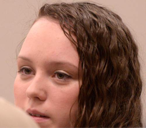 Al Hartmann  |  The Salt Lake Tribune
Meagan Grunwald who is charged as an accomplice in a shooting spree that killed one police officer and wounded another on January 30, 2014 listens to testimony in Judge Darold McDade's courtroom in Provo Thursday April 30.