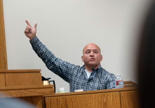 Al Hartmann  |  The Salt Lake Tribune
Truck driver Alonzo VanTassell describes looking down from the cab of his truck and seeing an arm with a gun emerge from the window of a pickup truck below him and shoot out three of his tires near Nephi on I-15.  This was testimony in the Megan Grunwald trial in Judge Darold McDade's courtroom in Provo Thursday April 30.   She is charged as an accomplice in a shooting spree that killed one police officer and wounded another on January 30, 2014.  Van Tassell said that incident changed his life and he no longer drives trucks for a living.