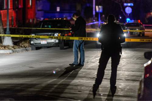Trent Nelson  |  The Salt Lake Tribune
Police investigate the scene of a shooting near Douglas and Parkway in Salt Lake City, Saturday January 24, 2015.