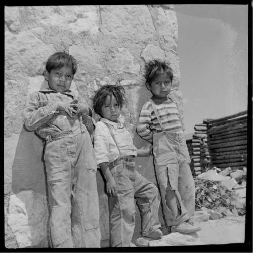 Salt Lake Tribune archive

Young Navajo boys at the St. Cristopher's Mission in Bluff, Utah, in 1950. St. Christopher's Episcopal Mission was established in 1943 when H. Baxter Liebler, an Episcopal priest from Old Greenwich, Connecticut came to Bluff to establish a mission among the Navajo people. St Christopher's is named after the patron saint of travelers.  When Father Liebler arrived in Bluff, there were no missions, schools, or medical/hospital facilities for the Navajo living in this remote Utah section of the reservation. Before arriving in southeast Utah, Father  Liebler studied the Navajo language to make his message comprehensible to the Dineh and compatible with their understanding of harmony.  He participated in Navajo ceremonies, wore his hair in the traditional Navajo style-long, pulled back and wrapped.
A year after the mission was established, a school was started which became the only school for the 1,500 Navajo living in the central part of the Utah strip of the Navajo Reservation. A hospital/ clinic building was completed in 1956.  An estimated 500 babies were born in the clinic during the years it was in operation.