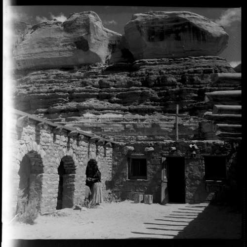 Salt Lake Tribune archive

St. Cristopher's Mission in Bluff, Utah, 1950. St. Christopher's Episcopal Mission was established in 1943 when H. Baxter Liebler, an Episcopal priest from Old Greenwich, Connecticut came to Bluff to establish a mission among the Navajo people. St Christopher's is named after the patron saint of travelers.  When Father Liebler arrived in Bluff, there were no missions, schools, or medical/hospital facilities for the Navajo living in this remote Utah section of the reservation. Before arriving in southeast Utah, Father  Liebler studied the Navajo language to make his message comprehensible to the Dineh and compatible with their understanding of harmony.  He participated in Navajo ceremonies, wore his hair in the traditional Navajo style-long, pulled back and wrapped. A year after the mission was established, a school was started which became the only school for the 1,500 Navajo living in the central part of the Utah strip of the Navajo Reservation. A hospital/ clinic building was completed in 1956.  An estimated 500 babies were born in the clinic during the years it was in operation.
