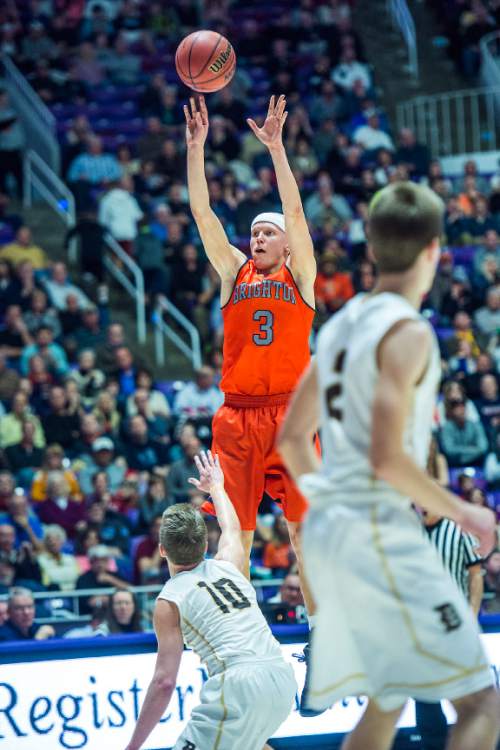 Chris Detrick  |  The Salt Lake Tribune
Brighton's Brock Miller (3) shoots over Davis' Jesse Wade (10) during the 5A semifinal game at the Dee Events Center Friday February 27, 2015.  Brighton defeated Davis 64-62.