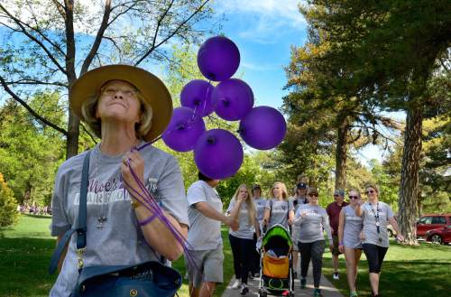 Scott Sommerdorf   |  The Salt Lake Tribune
Kallene Braithwaite, walks with her family at the front of The Walk to End Lupus Now at Liberty Park in Salt Lake City, Saturday, May 2, 2015. She is the mother of Emily Braithwaite, who had Lupus, and most recently passed away on April 15th. 
This year marks the 30th anniversary of the Utah Lupus Chapter.