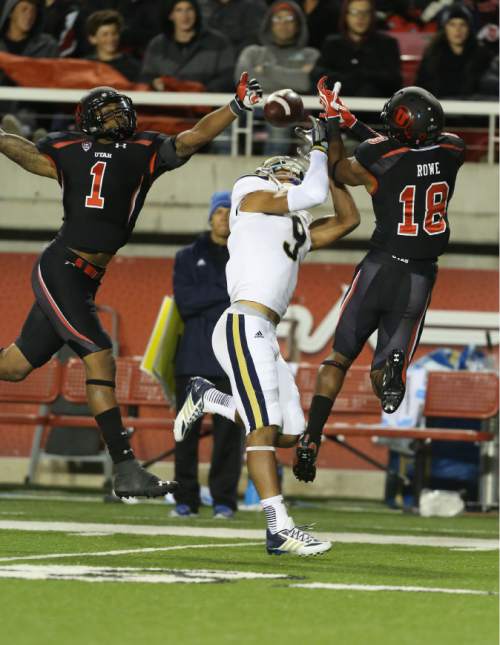 Francisco Kjolseth  |  The Salt Lake Tribune
Utah Utes defensive back Keith McGill (1), left, UCLA Bruins wide receiver Jordan Payton (9) and Utes defensive back Eric Rowe (18) go up for a ball In first quarter action between the University of Utah and UCLA at Rice Eccles stadium on Thursday, Oct. 3, 2013.