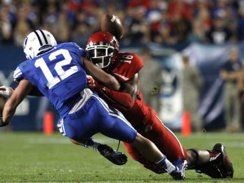 Rick Egan  | The Salt Lake Tribune 

Utah Utes defensive back Eric Rowe (18) hits Brigham Young Cougars wide receiver JD Falslev (12) forcing an incomplete pass, as BYU faced The University of Utah, at Lavell Edwards Stadium, Saturday, September 21, 2013.