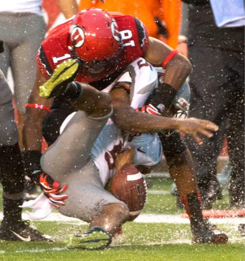 Rick Egan  |  The Salt Lake Tribune

Utah Utes defensive back Eric Rowe (18) tackles Washington State Cougars wide receiver Rickey Galvin (5), in Pac-12 football action, Utah vs. Washington State, at RIce-Eccles Stadium, September 27, 2014