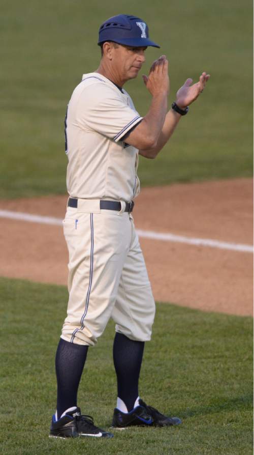 Steve Griffin  |  The Salt Lake Tribune

BYU coach Mike Littlewood cheers on his hitters from his third base coach position during the BYU and Utah baseball game at BYU in Provo, Tuesday, April 21, 2015.