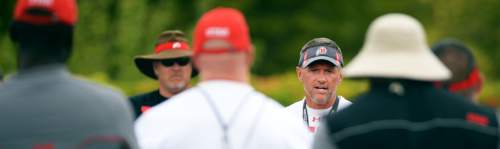 Steve Griffin  |  The Salt Lake Tribune


University of Utah head coach Kyle Whittingham talks with players and coaches following football practice on the campus of the University of Utah in Salt Lake City, Friday, August 22, 2014.