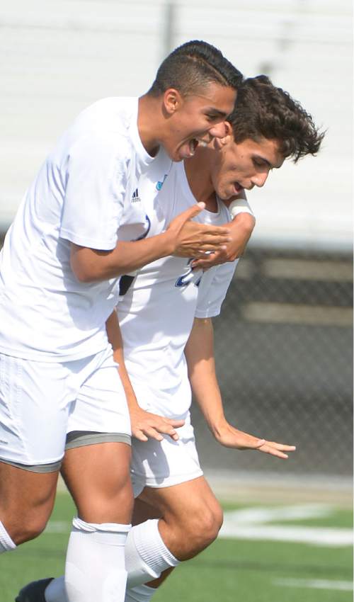 Leah Hogsten  |  The Salt Lake Tribune
Juan Diego's Julien Williamson celebrates his first half goal with Andre Alves. Juan Diego High School boys soccer hosted Hurricane High School during their state 3A first round game Thursday, April 30, 2015.