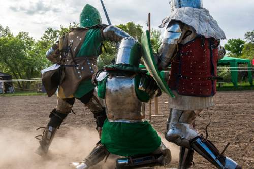 Chris Detrick  |  The Salt Lake Tribune
Armored Combat League member David C. Smith, left,r Jackson Meats, right, and Ben Warth fight at the The Utah Renaissance Festival & Fantasy Faire in Marriott-Slaterville Saturday May 2, 2015.  It opened Friday and continues 10 a.m.-6 p.m. on Saturday and Sunday. It will be open every Friday, Saturday and Sunday through May 24.