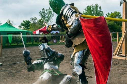 Chris Detrick  |  The Salt Lake Tribune
Armored Combat League member David C. Smith, right, and Ben Warth fight at the The Utah Renaissance Festival & Fantasy Faire in Marriott-Slaterville Saturday May 2, 2015.  It opened Friday and continues 10 a.m.-6 p.m. on Saturday and Sunday. It will be open every Friday, Saturday and Sunday through May 24.