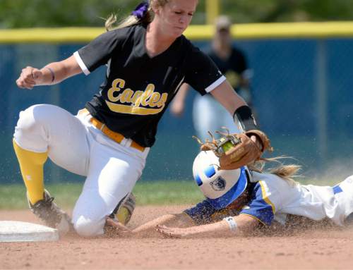 Al Hartmann  |  The Salt Lake Tribune
SLCC softball player Corrine Cleverly takes a long slide into second base but is tagged out by Golden Eagle's Marissa Johnson Friday May 1.