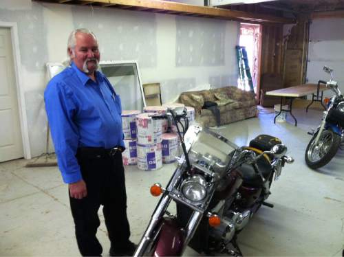 Nate Carlisle  |  The Salt Lake Tribune

Helaman Barlow stands besides motorcycles April 29, 2015, in his workshop in Colorado City, Ariz. Barlow used to be a marshal policing the polygamous towns of Colorado City and Hildale, Utah. He has since been confessing his misdeeds and those of others to the U.S. Department of Justice.