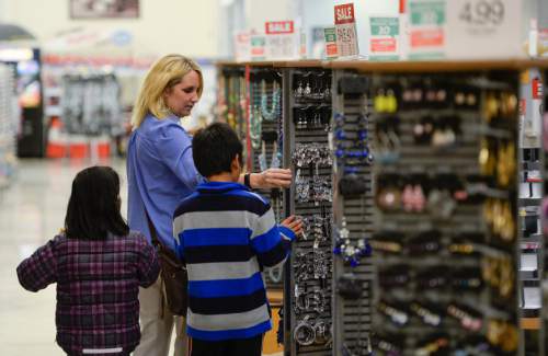 Francisco Kjolseth  |  The Salt Lake Tribune 
Kristie Tueller helps a couple of kids pick out gifts for their mother. In honor of Motherís Day, Smithís invited children from the YWCA to shop for free Motherís Day gifts with the help of a Smith's representative at 455 S. 500 East, in Salt LakeCity  on Monday, May 4, 2015.