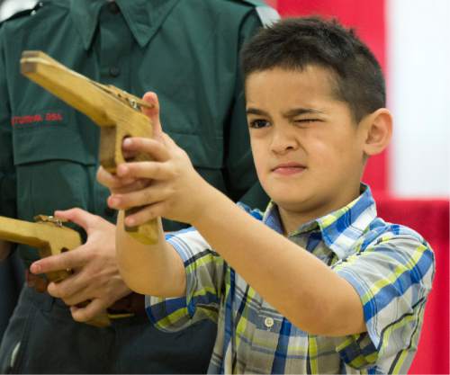 Rick Egan  |  The Salt Lake Tribune

Kiliati Fuahala, 6, takes aim as he shoots a rubber band gun, at the Utah Scouting Expo at the South Towne Expo Center, Saturday, May 2, 2015.