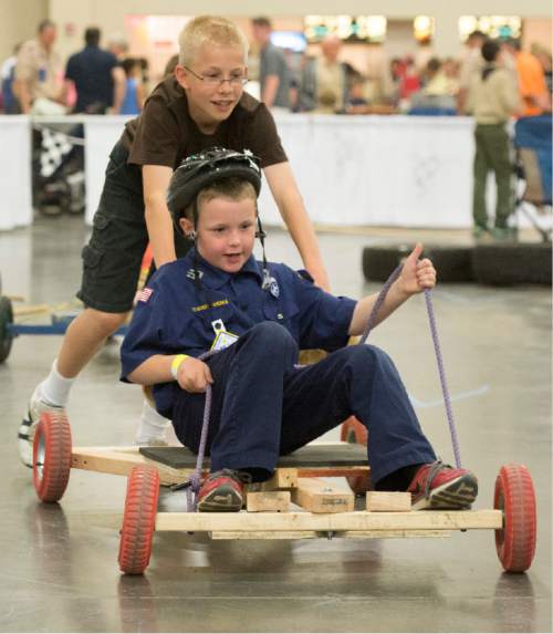 Rick Egan  |  The Salt Lake Tribune

Lincoln Halladay, 11, pushes his brother Elisha, 8, in the Push Cart Derby, at the Utah Scouting Expo at the South Towne Expo Center, Saturday, May 2, 2015.