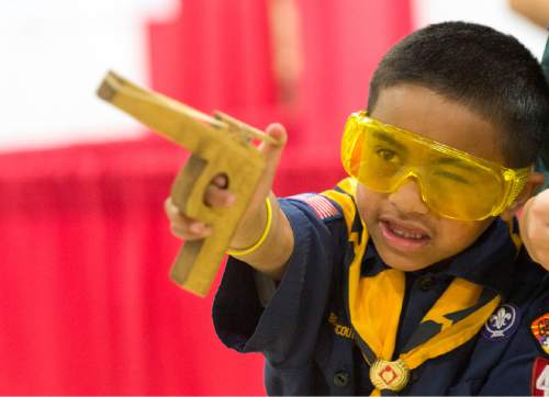 Rick Egan  |  The Salt Lake Tribune

Jerome Saili, 6, takes aim as he shoots a rubber band gun, at the Utah Scouting Expo at the South Towne Expo Center, Saturday, May 2, 2015.