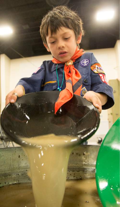 Rick Egan  |  The Salt Lake Tribune

Robert Da Silva, 7, pans for gold at the Utah Scouting Expo at the South Towne Expo Center, Saturday, May 2, 2015.