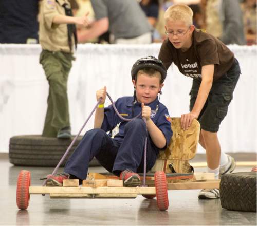 Rick Egan  |  The Salt Lake Tribune

Lincoln Halladay, 11, pushes his brother Elisha, 8, in the Push Cart Derby, at the Utah Scouting Expo at the South Towne Expo Center, Saturday, May 2, 2015.