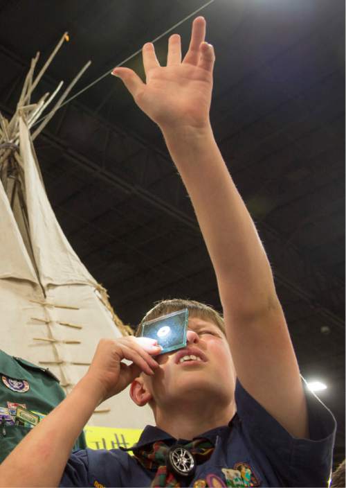 Rick Egan  |  The Salt Lake Tribune

Thatcher Carlson, 10, practices his mirror signaling, at the Utah Scouting Expo at the South Towne Expo Center, Saturday, May 2, 2015.