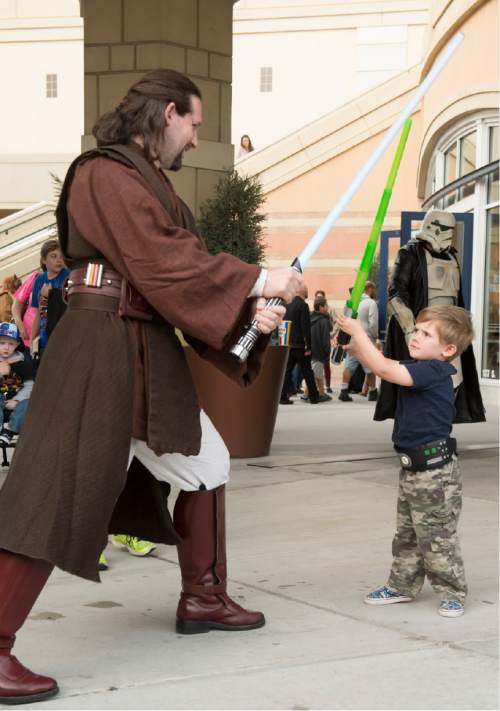 Rick Egan  |  The Salt Lake Tribune

Cormac Harrington, 3, fights Jakob Tice to celebrate Star Wars Day with Salt Lake Comic Con and Urban Arts Gallery at The Gateway, Monday, May 4, 2015.