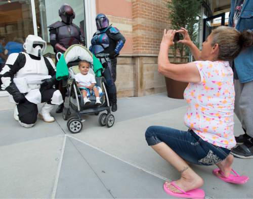 Rick Egan  |  The Salt Lake Tribune

Kathy Maestas snaps a photo with Davin Maestas, 2, as he poses with some Star Wars characters to celebrate Star Wars Day with Salt Lake Comic Con and Urban Arts Gallery at The Gateway, Monday, May 4, 2015.