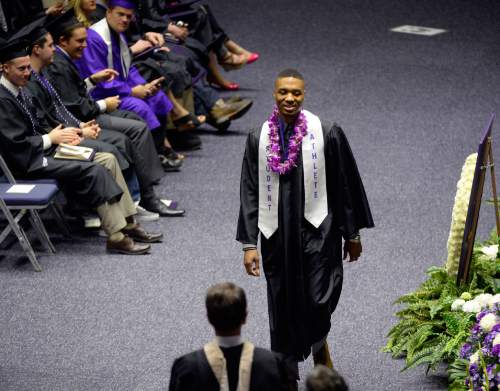 Al Hartmann  |  The Salt Lake Tribune
Damian Lillard, point guard for the Portland Trail Blazers, walks across floor of Dee Events Center Friday May 1 to finally graduate and receive his diploma. He  was six credits shy of graduating when he was drafted in 2012, but polished off his classes in the offseason.