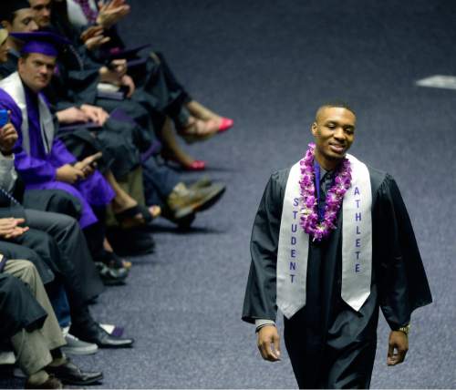 Al Hartmann  |  The Salt Lake Tribune
Damian Lillard, point guard for the Portland Trail Blazers, walks across floor of Dee Events Center Friday May 1 to finally graduate and receive his diploma. He  was six credits shy of graduating when he was drafted in 2012, but polished off his classes in the offseason.